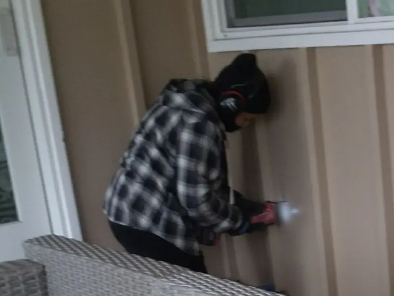 Professional electrician installing an exterior outlet in Cross Mountain