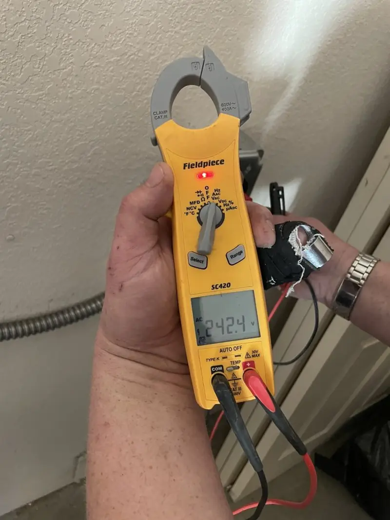 Voltage testing with clamp meter during Generator Installation in Cross Mountain